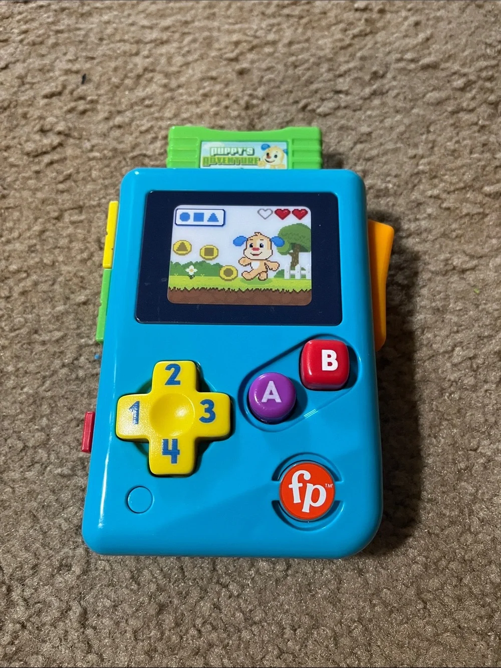 Fisher-Price Blue Handheld Learning Game with Yellow D-Pad and Red Button